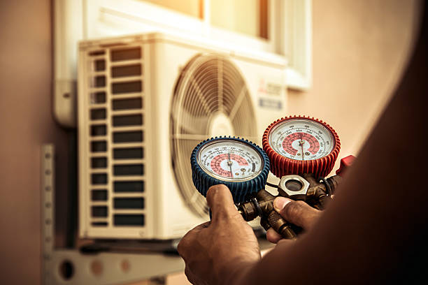 Professional Air Conditioning Service technician working in Holder, FL